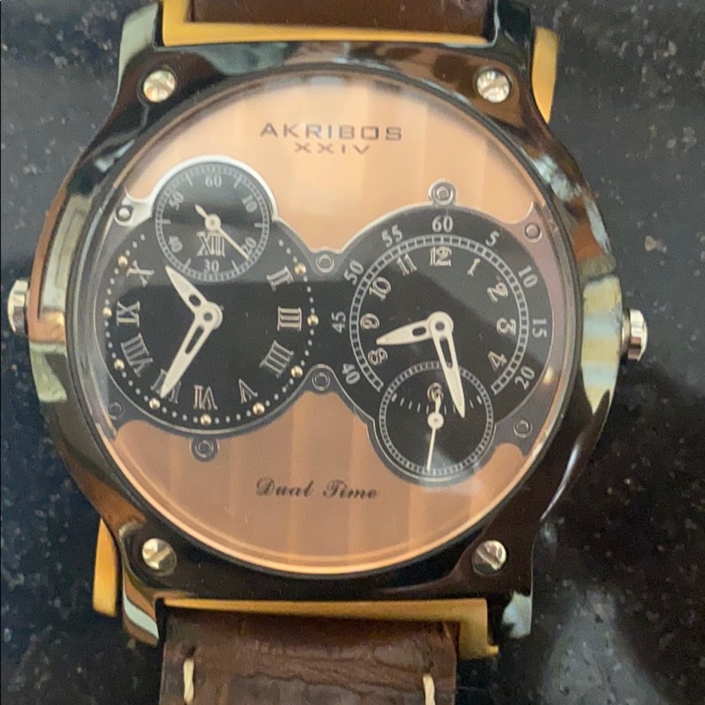 Akribos XXIV dual time rose face watch